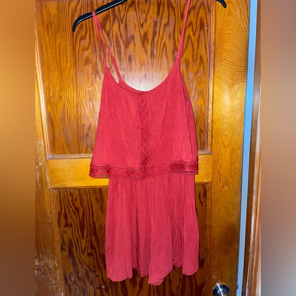 Garage romper, color rust. Size Small.